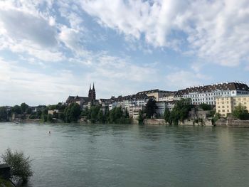 View of bridge over river against cloudy sky