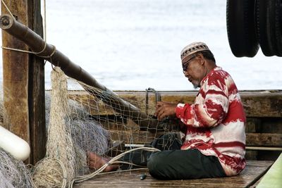 Man weaving fishing net