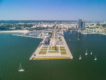 High angle view of buildings by sea against sky, aerial view on the port in gdynia, poland