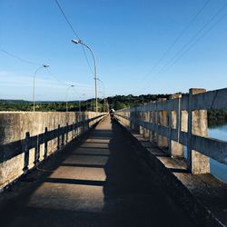 Empty road along trees