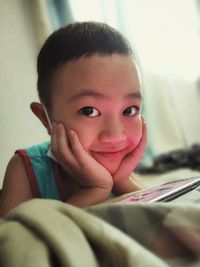 Close-up portrait of cute boy at home