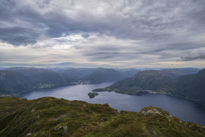 Scenic view of lake and mountains against sky