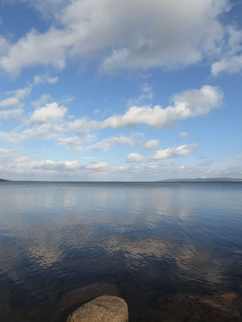 water, tranquil scene, tranquility, scenics, sky, beauty in nature, lake, reflection, nature, cloud - sky, idyllic, sea, waterfront, cloud, calm, rippled, non-urban scene, remote, outdoors, day