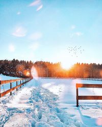 Frozen lake against sky during winter