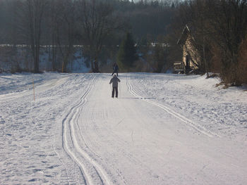 Man skiing on snow covered field