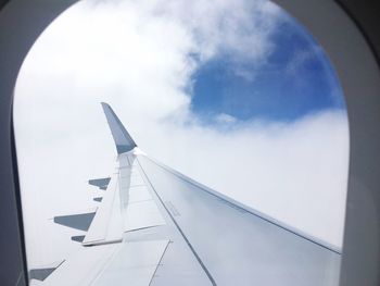 Low angle view of airplane flying in sky