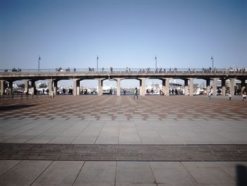 View of bridge in city against clear sky