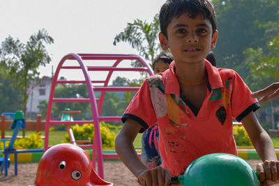 Portrait of boy playing outdoors