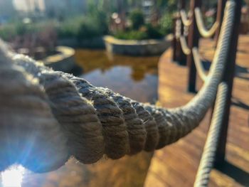 Close-up of rope tied on metal