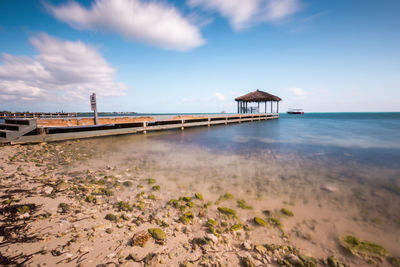 Pier over sea against sky