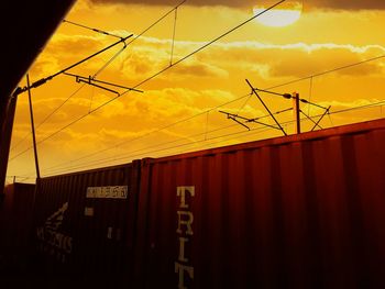 Low angle view of chainlink fence against sky