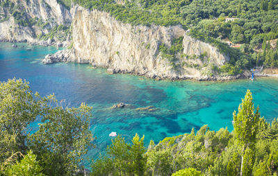 High angle view of rocks by sea