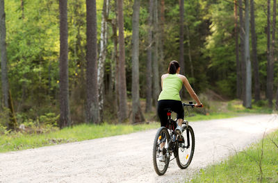 Man riding bicycle on road