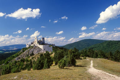 Panoramic shot of building and trees against sky