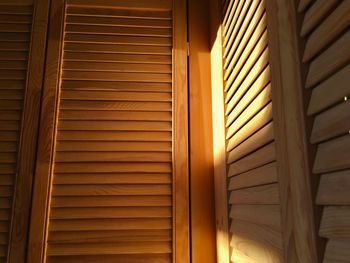 Sunlight falling on wooden cabinet at home