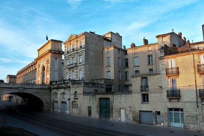 Low angle view of buildings against sky in city