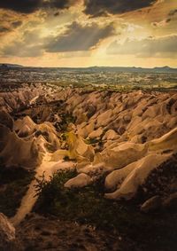 Aerial view of landscape against cloudy sky