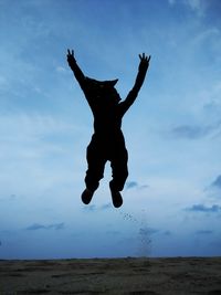 Full length of woman jumping in lake