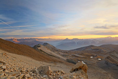 Scenic view of landscape against sky during sunset