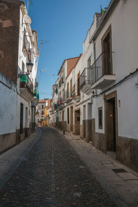 Narrow alley amidst buildings in city