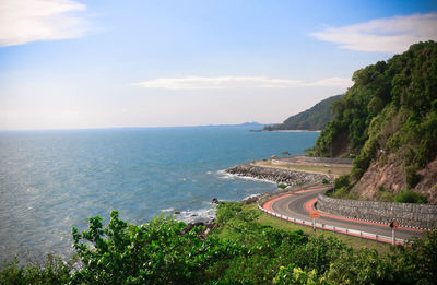 High angle view of road by sea against sky