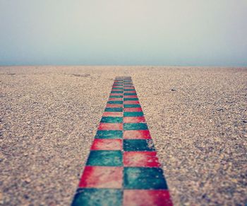 Empty road along landscape