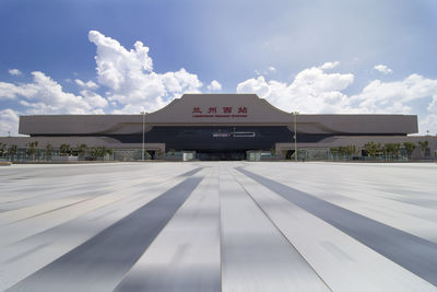 Empty parking lot against sky in city