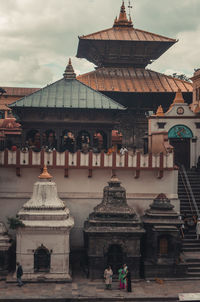 Group of people in temple against building