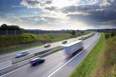 Blurred motion of highway against sky