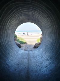 Panoramic view of people in tunnel