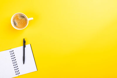 Directly above shot of coffee cup on table