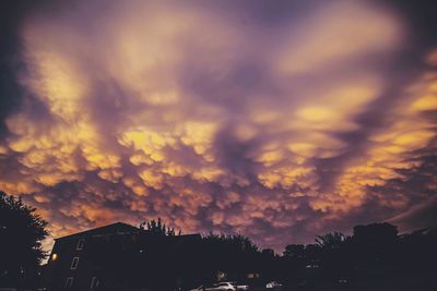 City against cloudy sky at sunset