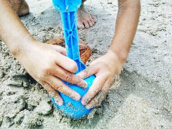 Low section of people playing on beach