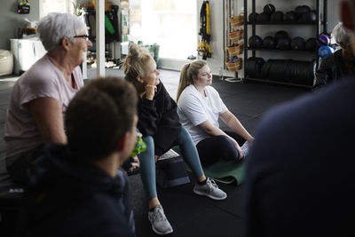 Group of people talking together in gym