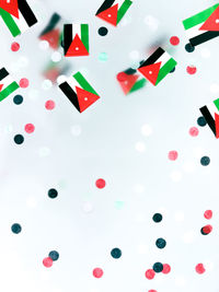 High angle view of multi colored pencils over white background