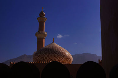 Low angle view of built structure against blue sky