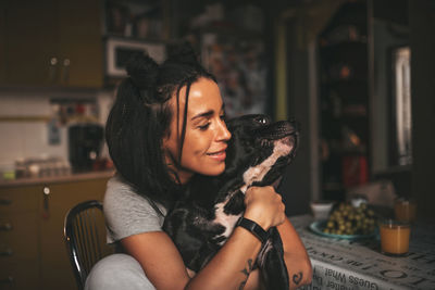 Portrait of smiling young woman at home