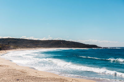 Scenic view of sea against blue sky