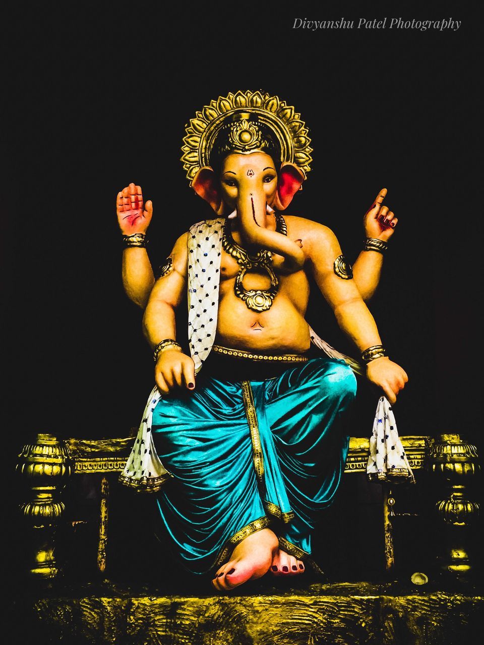 VIEW OF STATUE AGAINST ILLUMINATED BUDDHA