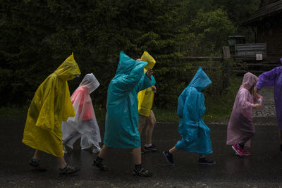 People wearing raincoats
