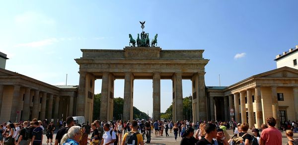 Group of people in front of historical building