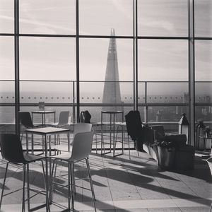 Woman sitting on chair in cafe