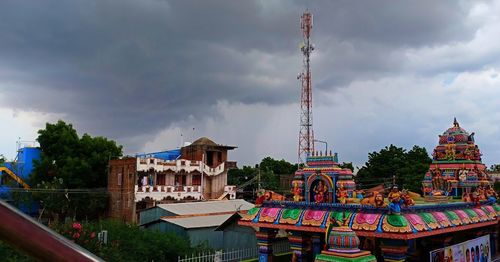 Multi colored buildings in city against sky