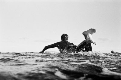 Woman jumping in sea