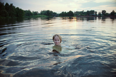 Portrait of teenage girl swimming in pool