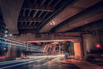 View of bridge in city at night