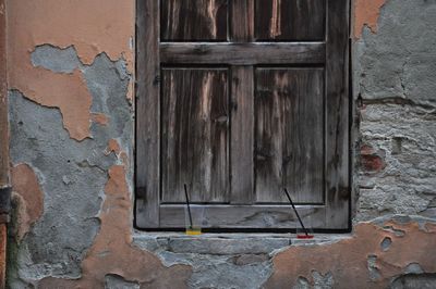 Close-up of closed door of old building