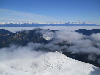 Scenic view of snow covered mountains