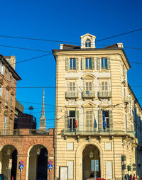 Low angle view of building against blue sky