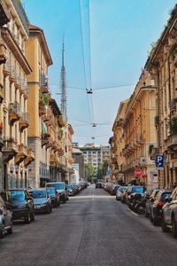 City street and buildings against sky